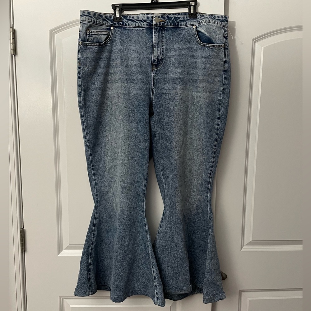 Arula bell bottom flare denim jeans with lace up tie on the back